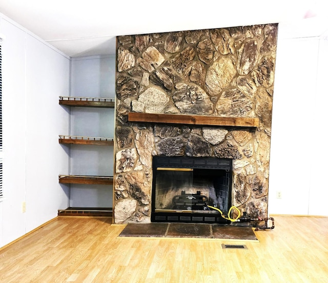 271 Candlemakers Ln, Rustburg, VA 24588 - detailed view of wood finished floors, a stone fireplace, and crown molding