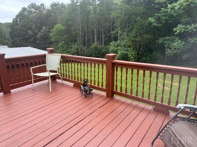 2022 New Chapel Rd, Rustburg, VA 24588 - wooden terrace featuring a forest view and a lawn