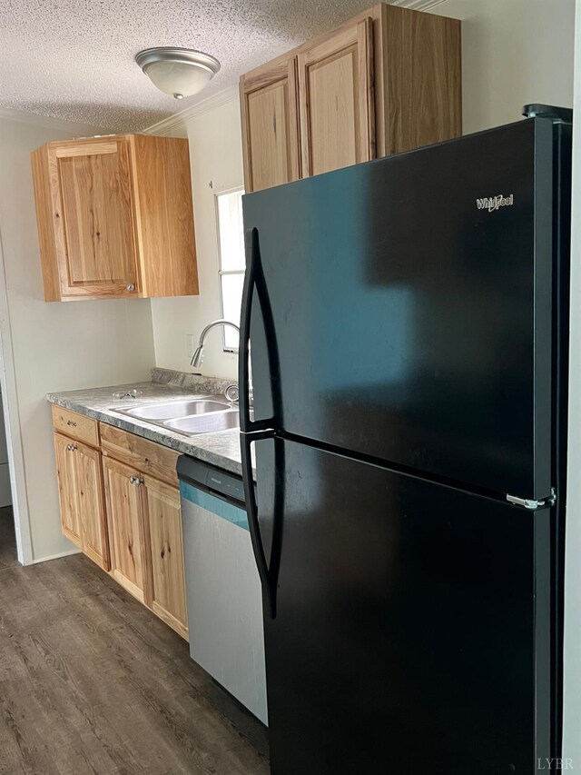 12440 E Gretna Rd, Gretna, VA 24557 - kitchen with freestanding refrigerator, dishwasher, light brown cabinets, dark wood-type flooring, and a textured ceiling