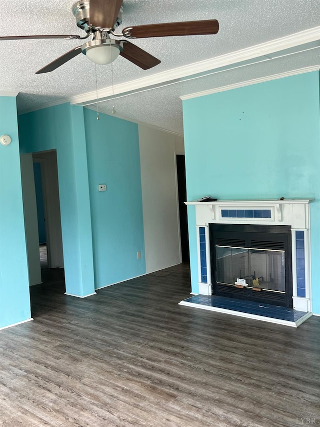 12440 E Gretna Rd, Gretna, VA 24557 - unfurnished living room featuring a tile fireplace, wood finished floors, a textured ceiling, ceiling fan, and ornamental molding