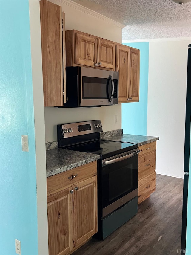 12440 E Gretna Rd, Gretna, VA 24557 - kitchen featuring stainless steel appliances, dark wood finished floors, a textured ceiling, crown molding, and brown cabinets