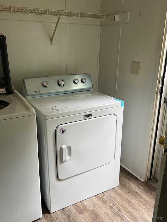 12440 E Gretna Rd, Gretna, VA 24557 - washroom with separate washer and dryer and light wood finished floors