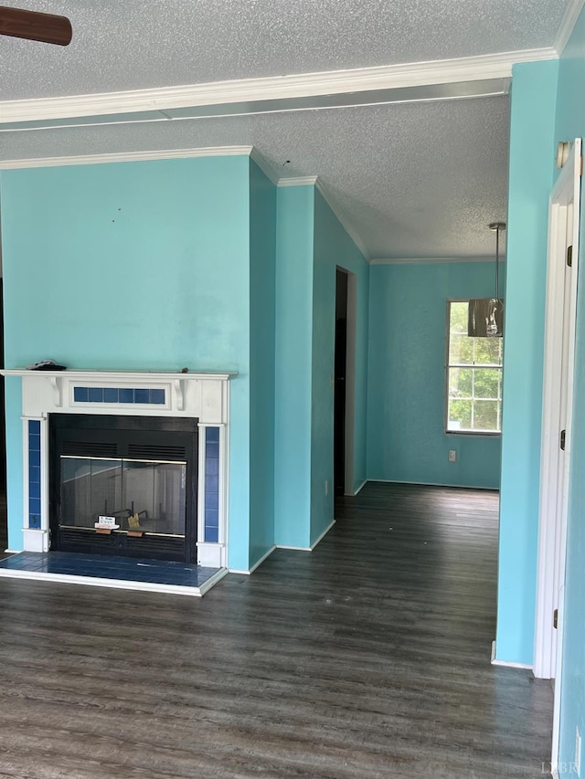 12440 E Gretna Rd, Gretna, VA 24557 - unfurnished living room with a textured ceiling, a tiled fireplace, wood finished floors, and ornamental molding