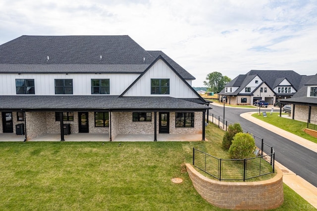 87 S Westyn Loop, Forest, VA 24551 - back of house featuring a shingled roof, a patio, board and batten siding, a residential view, and brick siding