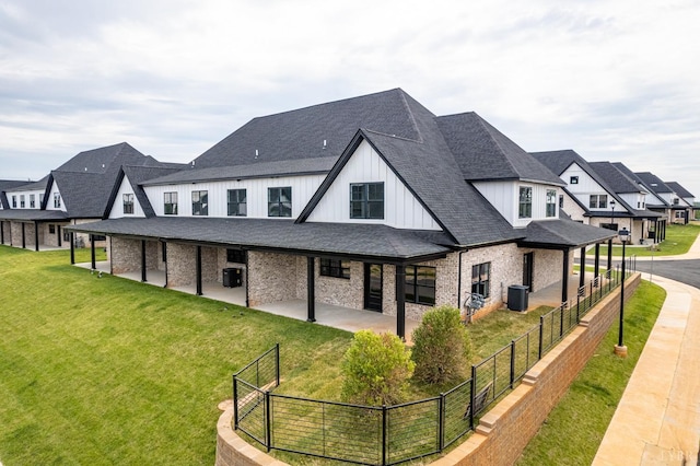 87 S Westyn Loop, Forest, VA 24551 - back of house featuring board and batten siding, a patio area, roof with shingles, brick siding, and a residential view