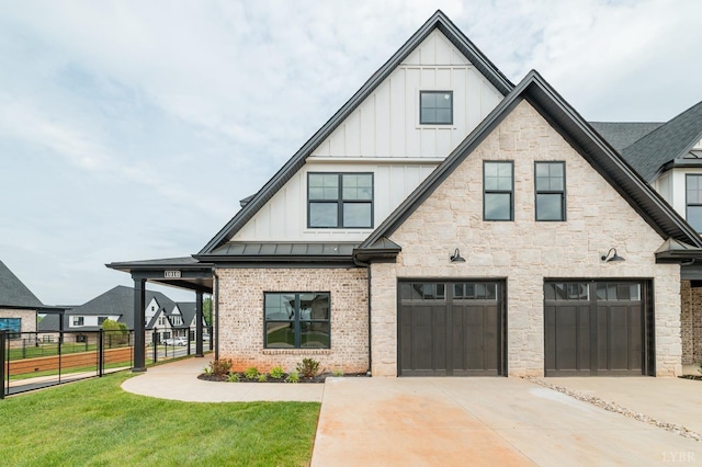 87 S Westyn Loop, Forest, VA 24551 - view of front of home with board and batten siding, concrete driveway, a garage, a standing seam roof, and a metal roof