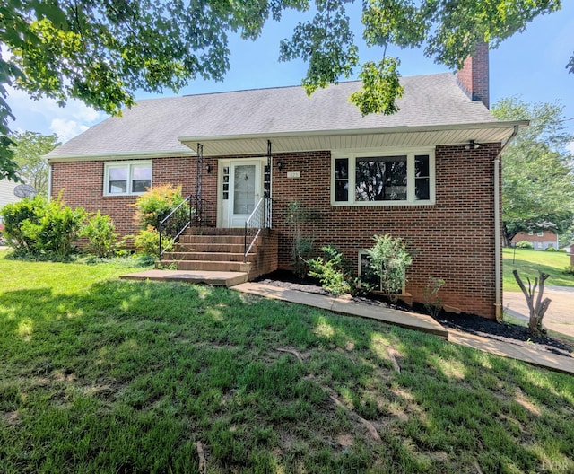 625 Sherman Dr, Lynchburg, VA 24502 - view of front facade featuring a front lawn, a chimney, brick siding, and roof with shingles