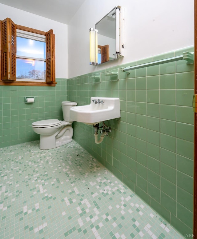 625 Sherman Dr, Lynchburg, VA 24502 - half bath with tile patterned flooring, tile walls, and a wainscoted wall