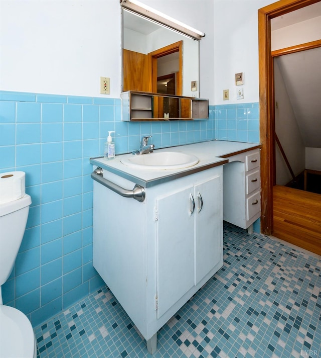 625 Sherman Dr, Lynchburg, VA 24502 - bathroom with tile patterned flooring, vanity, tile walls, and wainscoting