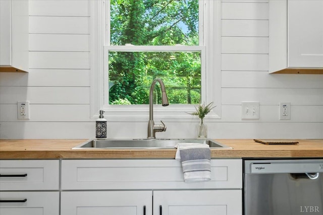121 Brooke St, Brookneal, VA 24528 - kitchen with dishwasher, wood counters, and white cabinets