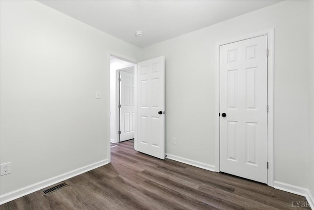 121 Brooke St, Brookneal, VA 24528 - unfurnished bedroom with dark wood-style floors and baseboards