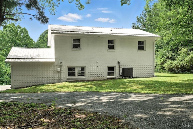 121 Brooke St, Brookneal, VA 24528 - back of property with a yard and a metal roof