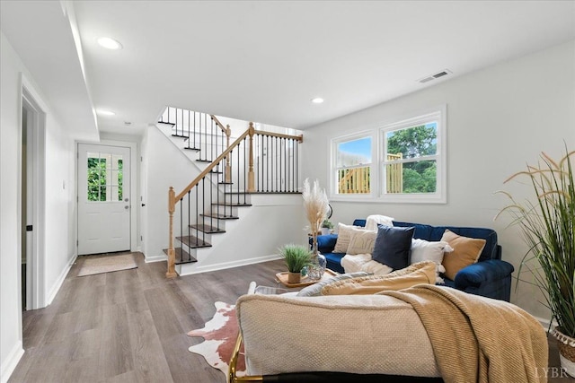 121 Brooke St, Brookneal, VA 24528 - living room featuring wood finished floors, stairway, and recessed lighting