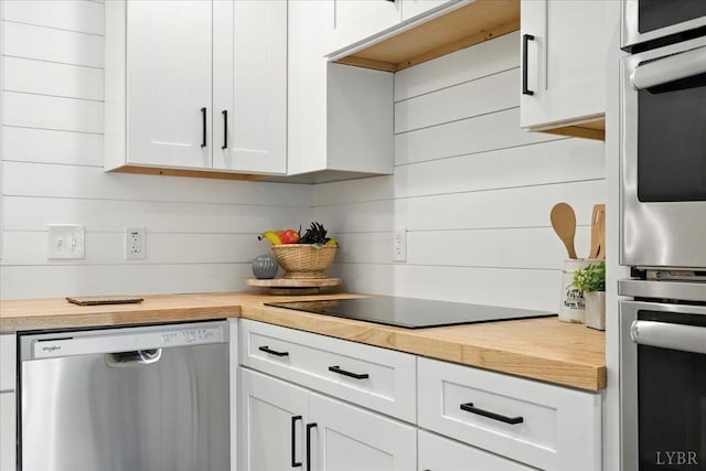 121 Brooke St, Brookneal, VA 24528 - kitchen featuring stainless steel appliances, wooden counters, and white cabinetry