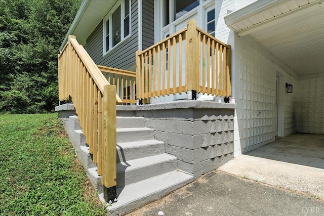 121 Brooke St, Brookneal, VA 24528 - property entrance with a wooden deck, driveway, and an attached carport