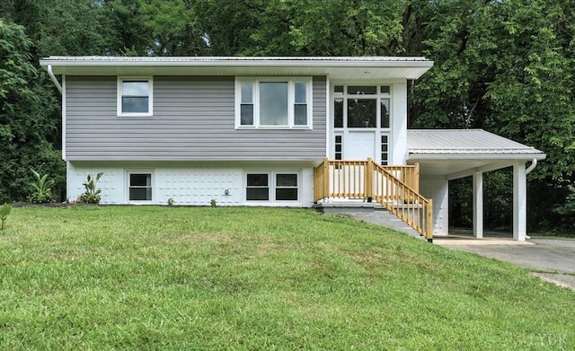 121 Brooke St, Brookneal, VA 24528 - view of front of property featuring a front yard, a metal roof, driveway, and an attached carport