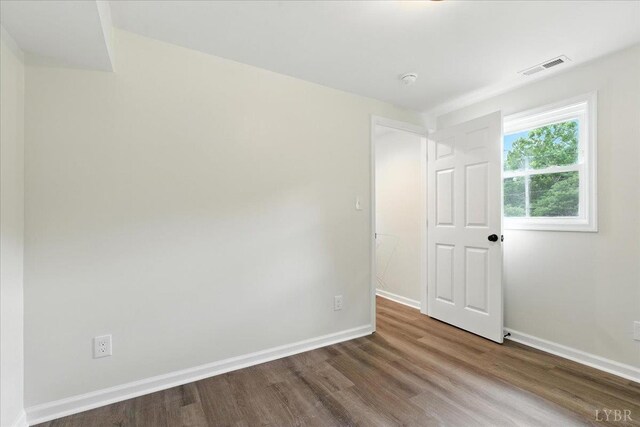 121 Brooke St, Brookneal, VA 24528 - empty room with wood finished floors and baseboards