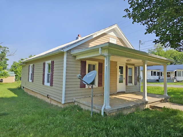 1275 Cedar Ave, Buena Vista, VA 24416 - view of property exterior featuring covered porch and a yard