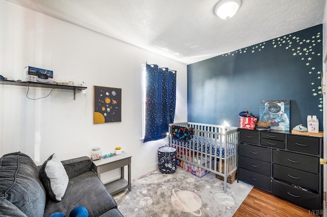 899 Brook St, Lynchburg, VA 24501 - bedroom featuring wood finished floors and a textured ceiling