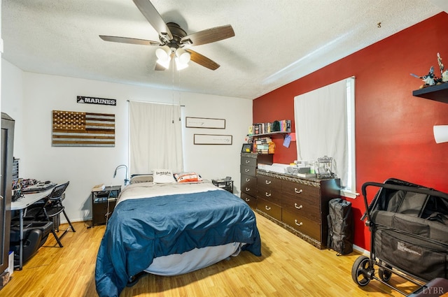 899 Brook St, Lynchburg, VA 24501 - bedroom with light wood-type flooring, a textured ceiling, and ceiling fan