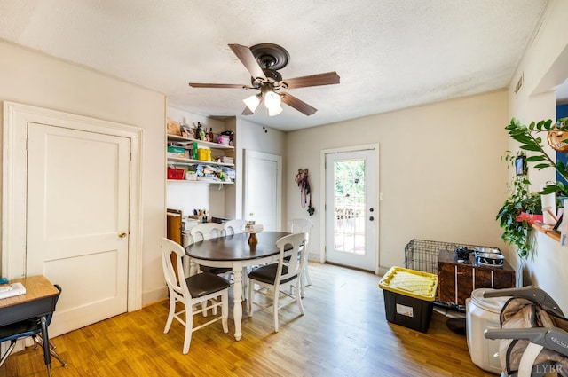 899 Brook St, Lynchburg, VA 24501 - dining room with a ceiling fan, light wood finished floors, and a textured ceiling