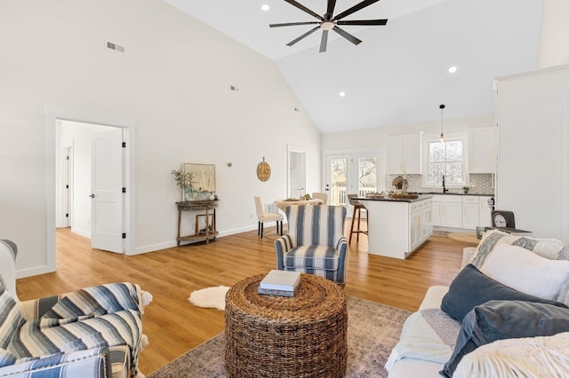 7 Hickory Cove Ln, Moneta, VA 24121 - living area with high vaulted ceiling, ceiling fan, light wood-style floors, and recessed lighting