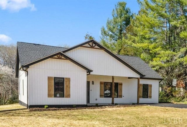 7 Hickory Cove Ln, Moneta, VA 24121 - rear view of house featuring a lawn and roof with shingles