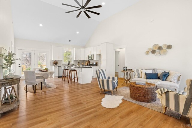 7 Hickory Cove Ln, Moneta, VA 24121 - living room with high vaulted ceiling, ceiling fan, light wood-style floors, and recessed lighting