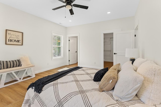 7 Hickory Cove Ln, Moneta, VA 24121 - bedroom featuring light wood-type flooring, a spacious closet, recessed lighting, and a ceiling fan