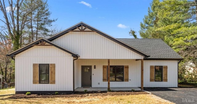 7 Hickory Cove Ln, Moneta, VA 24121 - modern farmhouse style home with covered porch and a shingled roof