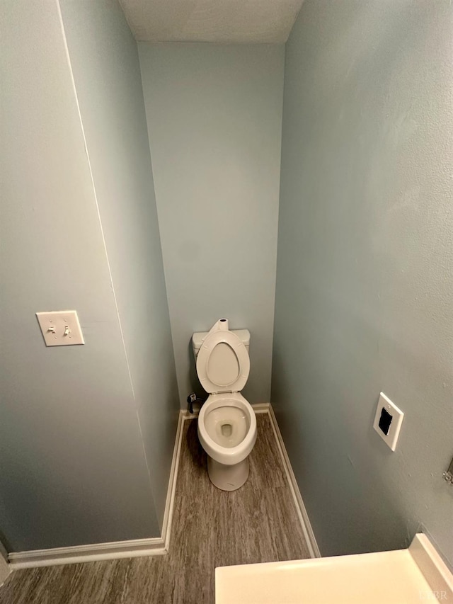 1310 9th St, Lynchburg, VA 24501 - bathroom with wood finished floors and toilet