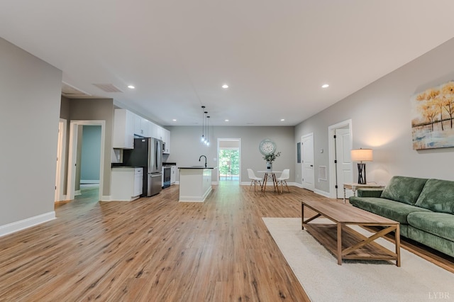 109 Tosh Ln, Goodview, VA 24095 - living area with light wood finished floors and recessed lighting