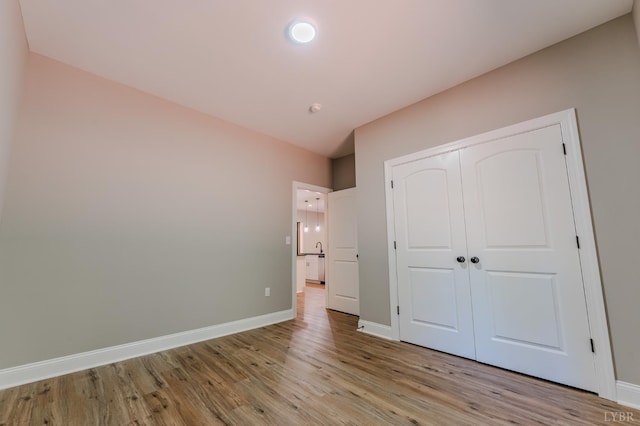 109 Tosh Ln, Goodview, VA 24095 - unfurnished bedroom with light wood-type flooring and a closet