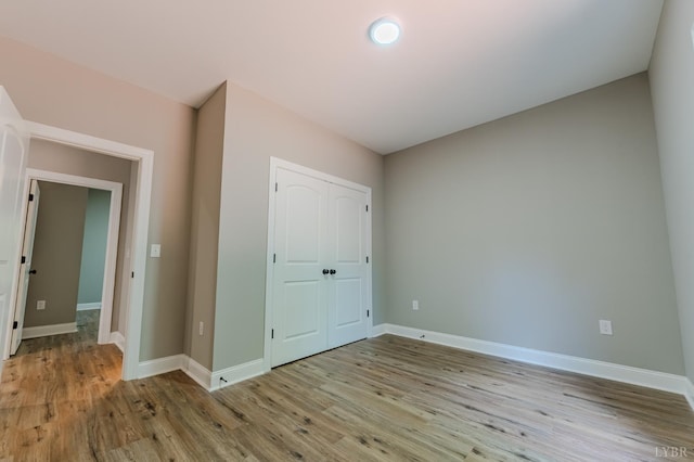 109 Tosh Ln, Goodview, VA 24095 - unfurnished bedroom with wood finished floors and a closet