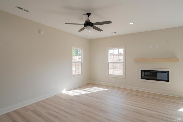 1016 Misty Mountain Rd, Lynchburg, VA 24502 - unfurnished living room with light wood-style floors, a glass covered fireplace, recessed lighting, and ceiling fan
