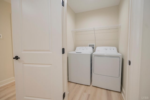 1016 Misty Mountain Rd, Lynchburg, VA 24502 - washroom featuring washing machine and clothes dryer and light wood-style flooring