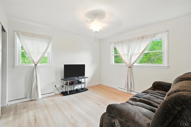 7131 Meadowbrook Rd, Lynchburg, VA 24502 - living area featuring wood finished floors, baseboard heating, and a ceiling fan