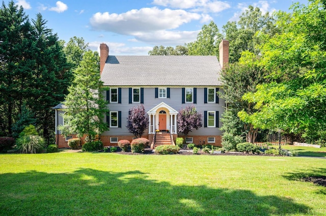 104 Overlink Ct, Lynchburg, VA 24503 - colonial-style house featuring a chimney and a front yard