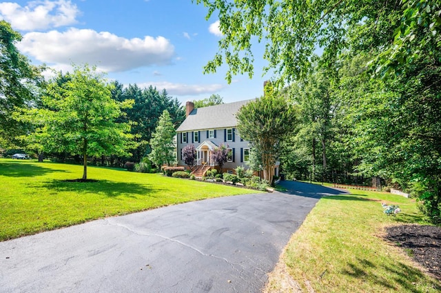 104 Overlink Ct, Lynchburg, VA 24503 - colonial house with a chimney, a front lawn, and driveway