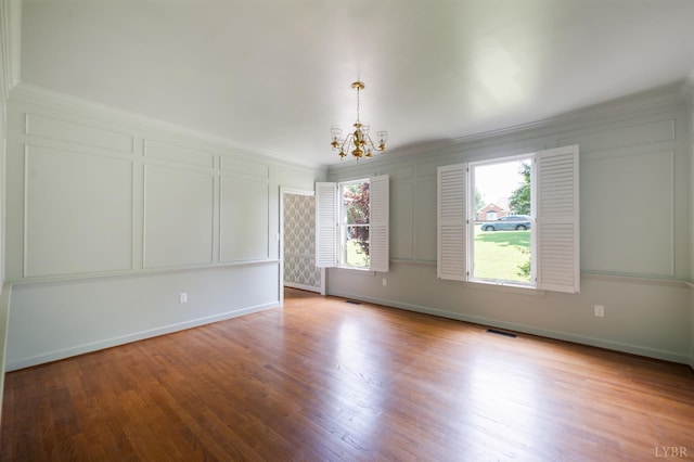 104 Overlink Ct, Lynchburg, VA 24503 - spare room featuring a chandelier, crown molding, wood finished floors, and a decorative wall
