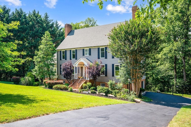 104 Overlink Ct, Lynchburg, VA 24503 - colonial home with a chimney, a front yard, and asphalt driveway
