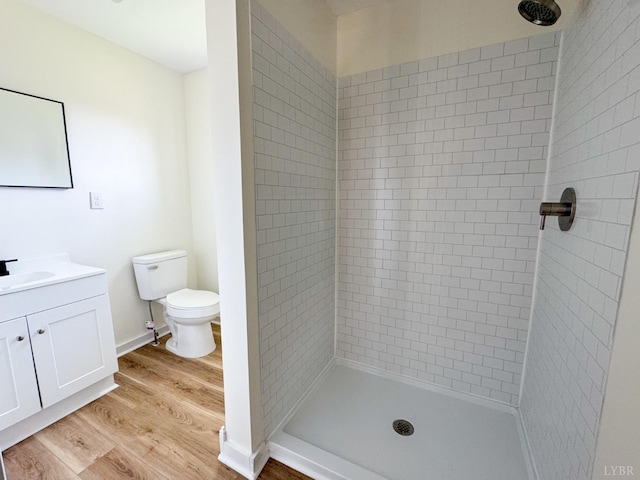 110 3rd St, Madison Heights, VA 24572 - bathroom featuring a tile shower, wood finished floors, and vanity