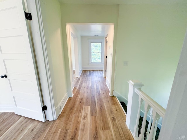 110 3rd St, Madison Heights, VA 24572 - hallway with light wood-style flooring and an upstairs landing
