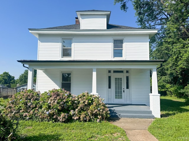 110 3rd St, Madison Heights, VA 24572 - american foursquare style home featuring a porch, a front yard, and a shingled roof