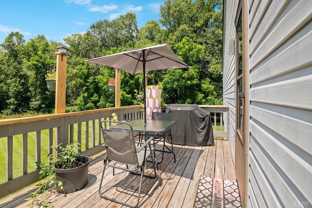 701 Goose Ridge Dr, Forest, VA 24551 - wooden deck featuring outdoor dining area, a yard, grilling area, and view of scattered trees
