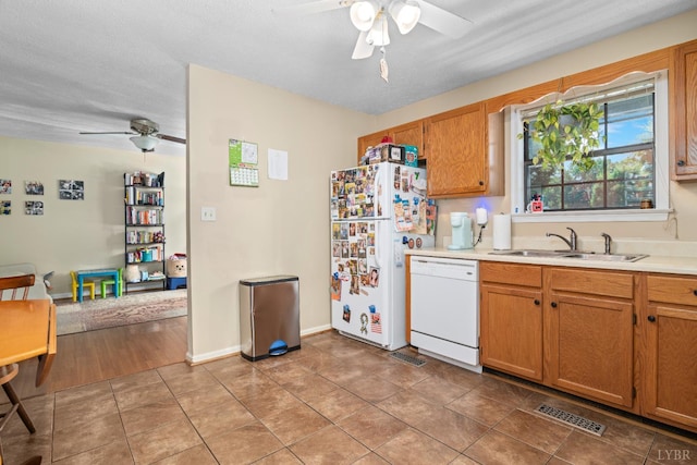 701 Goose Ridge Dr, Forest, VA 24551 - kitchen with white appliances, ceiling fan, light countertops, and light tile patterned floors