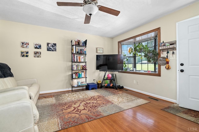 701 Goose Ridge Dr, Forest, VA 24551 - living room featuring wood finished floors, ceiling fan, and a textured ceiling