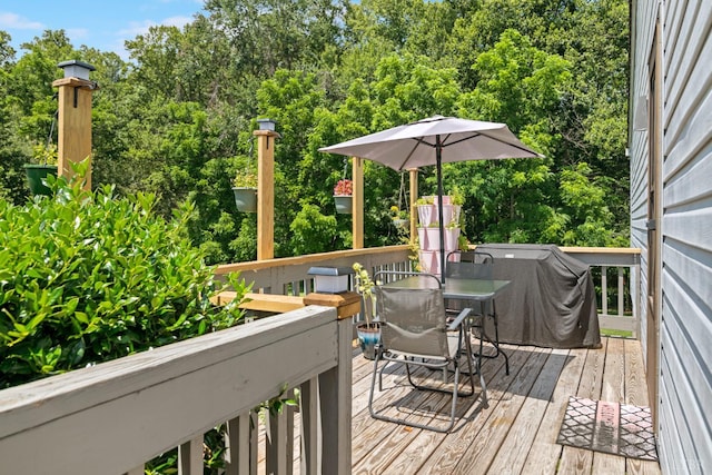 701 Goose Ridge Dr, Forest, VA 24551 - wooden terrace with outdoor dining area, area for grilling, and view of wooded area
