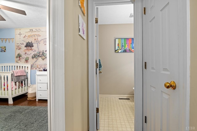 701 Goose Ridge Dr, Forest, VA 24551 - hallway featuring baseboards and a textured ceiling