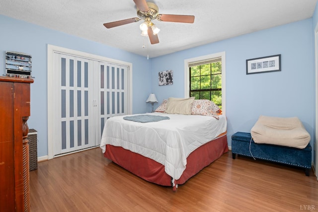 701 Goose Ridge Dr, Forest, VA 24551 - bedroom with wood finished floors, a textured ceiling, and a ceiling fan
